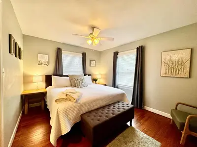 a bedroom with a bed and a ceiling fan at Hawks Nest in Marion