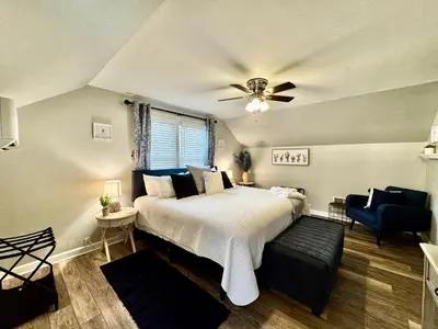 a bedroom with a bed and a ceiling fan at Hawks Nest in Marion