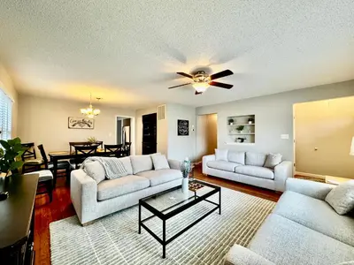 a living room with two couches and a table at Hawks Nest in Marion
