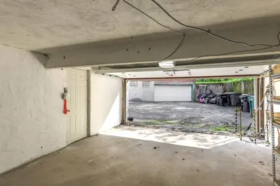 an empty room with a garage with a window at 1 Mi to University of Cincinnati Avondale Gem! in Cincinnati