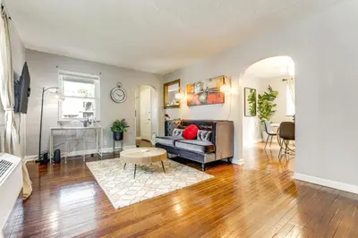 a living room with a couch and a table at 1 Mi to University of Cincinnati Avondale Gem! in Cincinnati