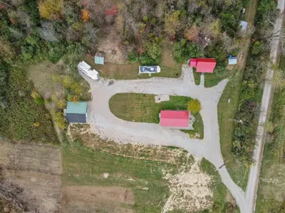 an aerial view of a field with a road at Big Spacious Camper in New Lexington