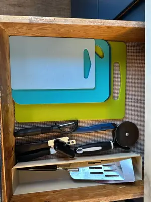 a drawer filled with tools in a wooden box at Off The Hook Vacation Rentals in Put-in-Bay
