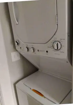 a white washer and dryer in a refrigerator at Short north- STEPS to High St -Private Parking-OSU in Columbus