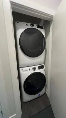 a microwave sitting on top of a oven in a room at The 513 Flat! 1BR, 1Bath Apt with Pool and Riverfront View! Free Gated Parking! Only Steps from The banks & Stadiums! in Cincinnati