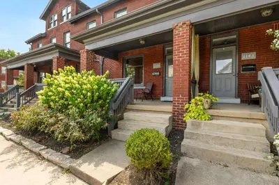 a brick house with stairs leading to the front door at Luxury Chefs Kitchen - OSU/Short North - Sleeps 10 in Columbus