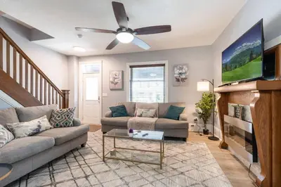 a living room with a couch and a ceiling fan at Luxury Chefs Kitchen - OSU/Short North - Sleeps 10 in Columbus