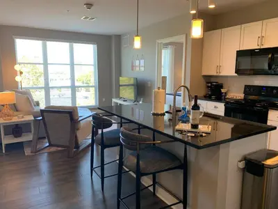 a kitchen with a island in the middle of a room at The City View Suite Garage Parking Top Floor! in Columbus