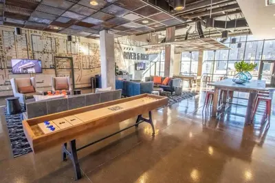 a room with a pool table in the middle of it at The City View Suite Garage Parking Top Floor! in Columbus