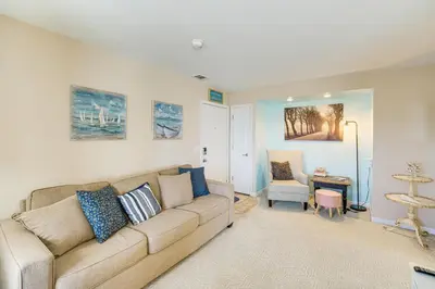 a living room with a couch and a chair at 1 Mi to Ferry Port Clinton Condo with Beach View! in Port Clinton
