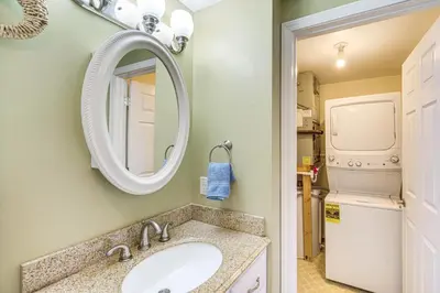 a bathroom with a sink and a mirror at 1 Mi to Ferry Port Clinton Condo with Beach View! in Port Clinton