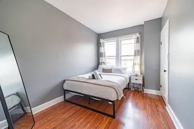 a bedroom with a bed and a window at Cozy Brick-Short North Condo - (fenced yard) - OSU in Columbus