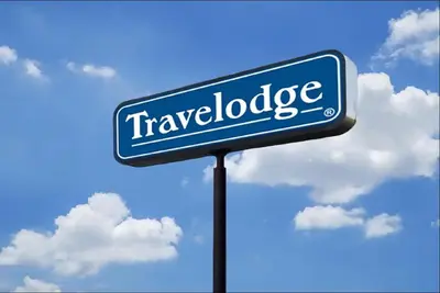 a blue street sign with the words travelodge on it at Travelodge by Wyndham Gallipolis in Gallipolis