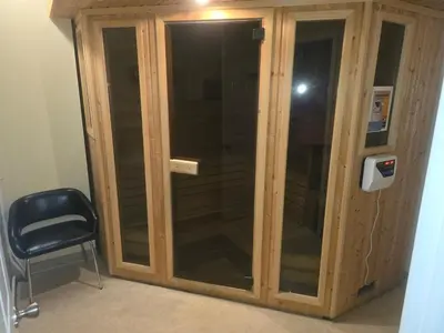 a wooden cabinet with glass doors in a room at Delightful Downtown Free parking in Cleveland