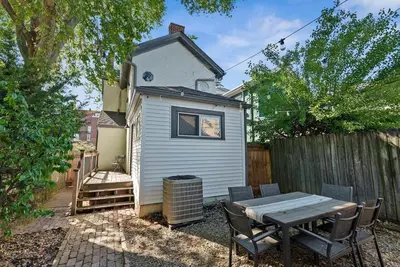 a tiny house with a table and chairs in the yard at Perfect location-Short North home HUGE4-car garage in Columbus