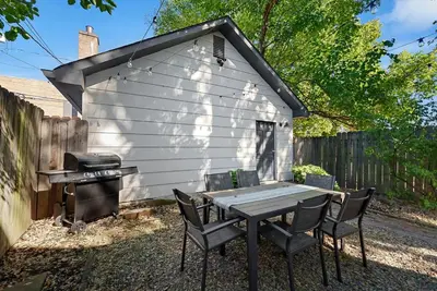 a picnic table and a grill in front of a shed at Perfect location-Short North home HUGE4-car garage in Columbus