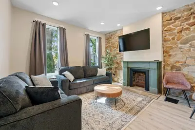 a living room with two couches and a fireplace at Perfect location-Short North home HUGE4-car garage in Columbus