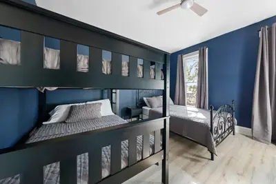 a bedroom with two bunk beds and blue walls at Perfect location-Short North home HUGE4-car garage in Columbus