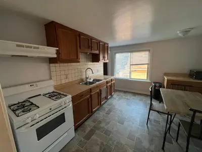 a kitchen with a white stove and a sink at Cleveland Airport - 2nd Floor - WonDos Apartment in Cleveland