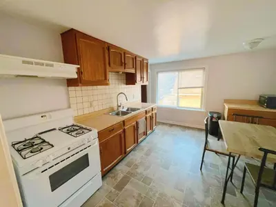 a kitchen with a white stove and a sink at Cleveland Airport - 2nd Floor - WonDos Apartment in Cleveland