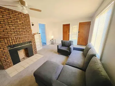 a living room with a couch and a fireplace at Cleveland Airport - 2nd Floor - WonDos Apartment in Cleveland