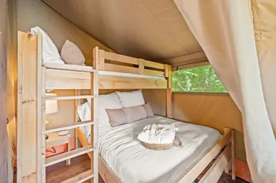 a bedroom with two bunk beds in a tent at Eden Reserve Glamping Tents - All 8 Tents in Williamstown