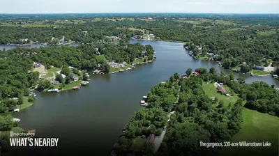 an aerial view of a lake with houses and trees at Eden Reserve Glamping Tents - All 8 Tents in Williamstown