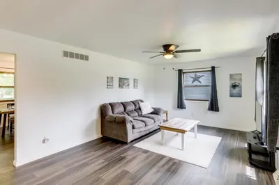 a living room with a couch and a table at 1 Mi to Freer Field Ashland Home with Yard! in Ashland
