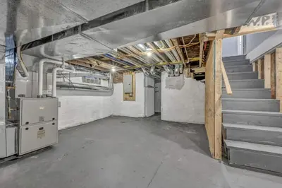 an empty room with stairs in a building at Tremont Jewel Group Stay in the Heart of Tremont in Cleveland