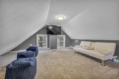 a living room with a couch and two chairs at Tremont Jewel Group Stay in the Heart of Tremont in Cleveland