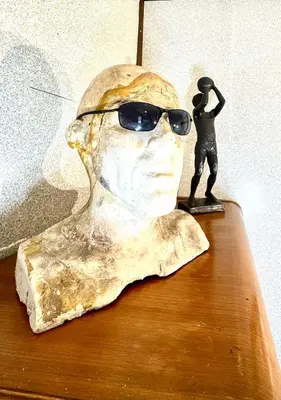 a statue of a man with sunglasses on a table at Sleep with a Lion!! 6 bedroom house, near downtown, Ohio city Tremont! in Cleveland