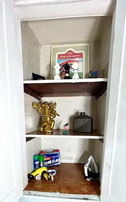 a shelf in a room with toys on it at Sleep with a Lion!! 6 bedroom house, near downtown, Ohio city Tremont! in Cleveland