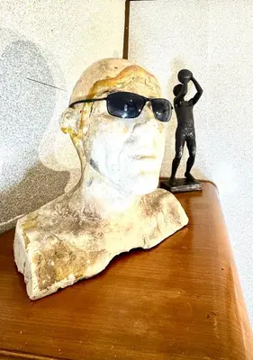 a statue of a man with sunglasses on a table at Sleep with a LION! 3 bedroom, near Downtown, Tremont, Ohio city!! in Cleveland