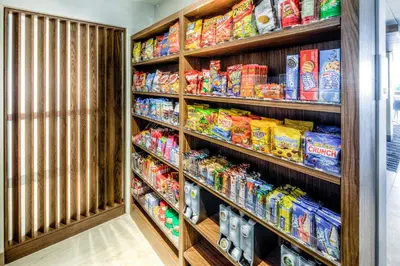 a walk in pantry filled with lots of food at Holiday Inn Express & Suites Cleveland/Westlake by IHG in Westlake
