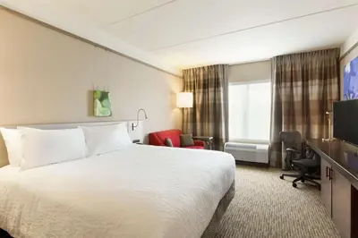 a hotel room with a bed and a television at Hilton Garden Inn Pittsburgh Airport South-Robinson Mall in Robinson Township
