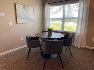 a dining room with a table and chairs and a window at Retreat At The Charles Fast WiFi WasherDryer in Dublin