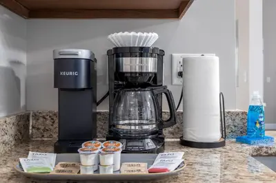 a kitchen counter with a blender on a counter at The Pondview Penthouse King Bed Balcony WD in Westerville