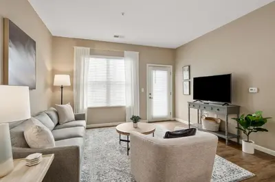 a living room with a couch and a tv at Cozy Dublin 2BR 1st Floor Easy Free Parking! in Dublin