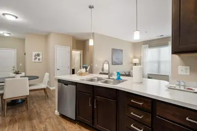 a kitchen with a sink and a counter top at Cozy Dublin 2BR 1st Floor Easy Free Parking! in Dublin