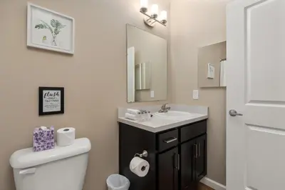 a bathroom with a white toilet and a sink at Cozy Dublin 2BR 1st Floor Easy Free Parking! in Dublin