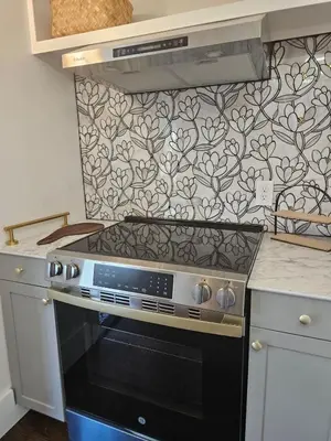 a kitchen with a black stove top oven at The Chelsea in Dayton