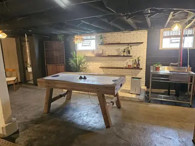 a ping pong table in the middle of a room at The Chelsea in Dayton