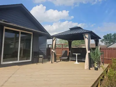 a large black umbrella on a wooden deck at The Chelsea in Dayton