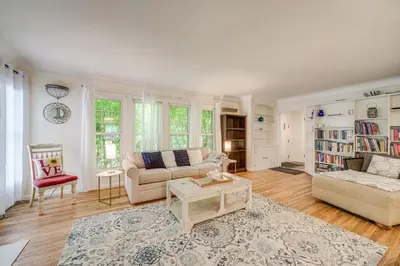 a living room with a couch and a table at Historic University Heights Home with Private Yard! in University Heights