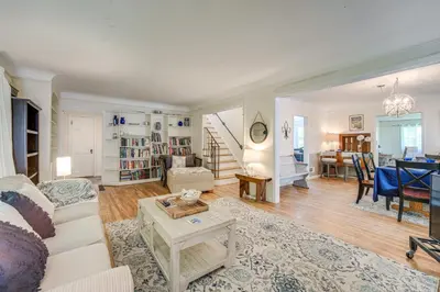 a living room with a couch and a table at Historic University Heights Home with Private Yard! in University Heights