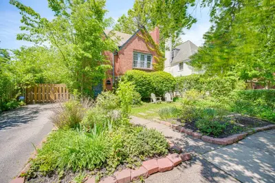 a home with a garden in the driveway at Historic University Heights Home with Private Yard! in University Heights