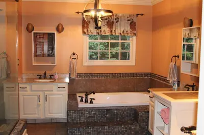 a bathroom with a tub and a sink at Family Friendly lodge located in the Hocking Hills in Rockbridge