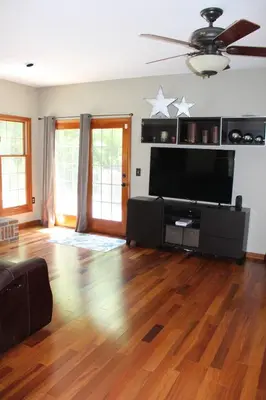 a living room with a large flat screen tv at Family Friendly lodge located in the Hocking Hills in Rockbridge