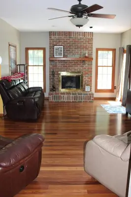 a living room with a couch and a fireplace at Family Friendly lodge located in the Hocking Hills in Rockbridge
