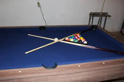 a clock on top of a pool table at Family Friendly lodge located in the Hocking Hills in Rockbridge